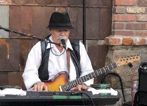 Photograph of Catfish Carl performing for 2018 Taste of Downtown