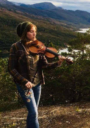 Photograph of Kat MacMartin enjoying music and nature